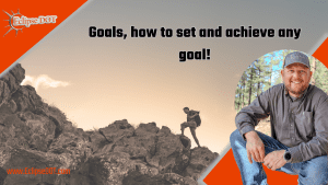 Image of a person standing on top of a mountain, overlooking a scenic landscape, with the text 'Goals: How to Set and Achieve Any Goal'.