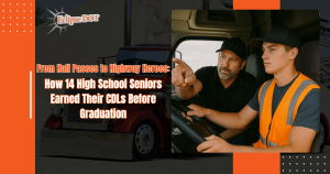 14 high school boys in front of a blue semi-truck after CDL training.