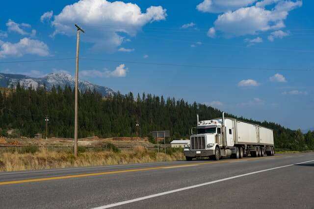 Semi-truck on highway symbolizing DOT compliance and safety